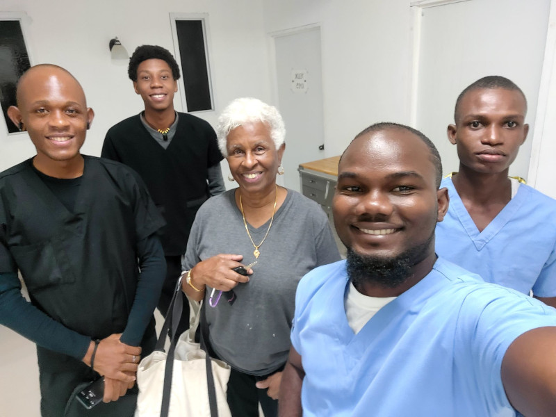 Image of Haitian optometry students in a group smiling.