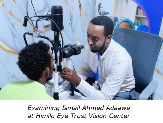 Hilmo Eye Trust eye exam with caption A photo of an optometrist in Somalia examining Ismail Ahmed Adaawe<br />
at the Himilo Eye Trust Vision Center